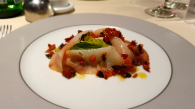 Cherrywood-smoked swordfish loin with caper tomato compote, olives and aromatic herbs