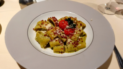 Paccheri pasta with traditional cured speck, rocket & pine nut pesto sauce and roasted tomatoes