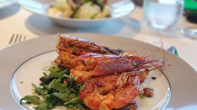 Grilled king prawns with rocket & nut salad, capers and tarragon lemon vinaigrette