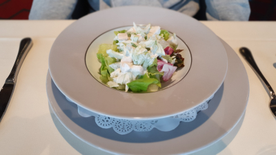 Waldorf salad with lettuce, chicken, green apples, celery, walnuts, yogurt, chives