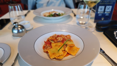 Ravioli with lobster sauce,  dilled ricotta filling, lobster morsels, fresh herbs