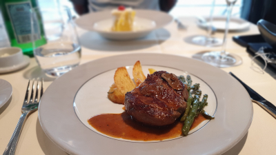 Grilled tournedos in Périgueux sauce with grilled asparagus, buttered carrots and rosemary oven-roasted potatoes